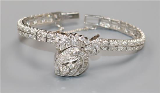 A ladys 14ct white gold and diamond encrusted Hamilton manual wind cocktail watch, the dial with hinged cover